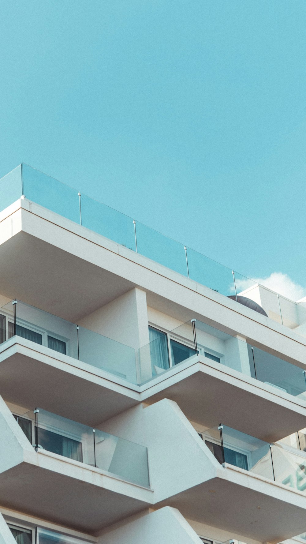 white and brown concrete building under blue sky during daytime