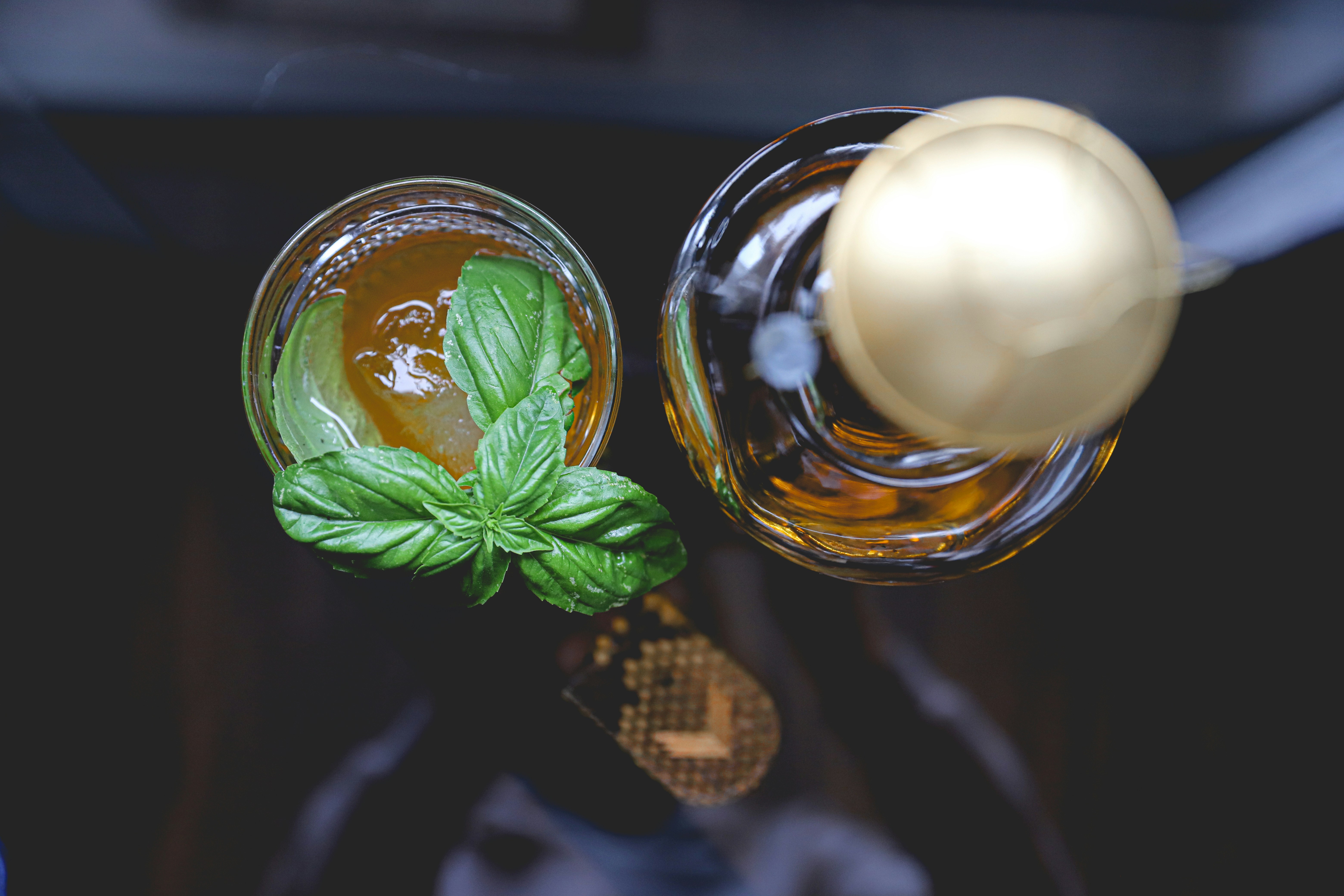 green leaf on clear glass bottle