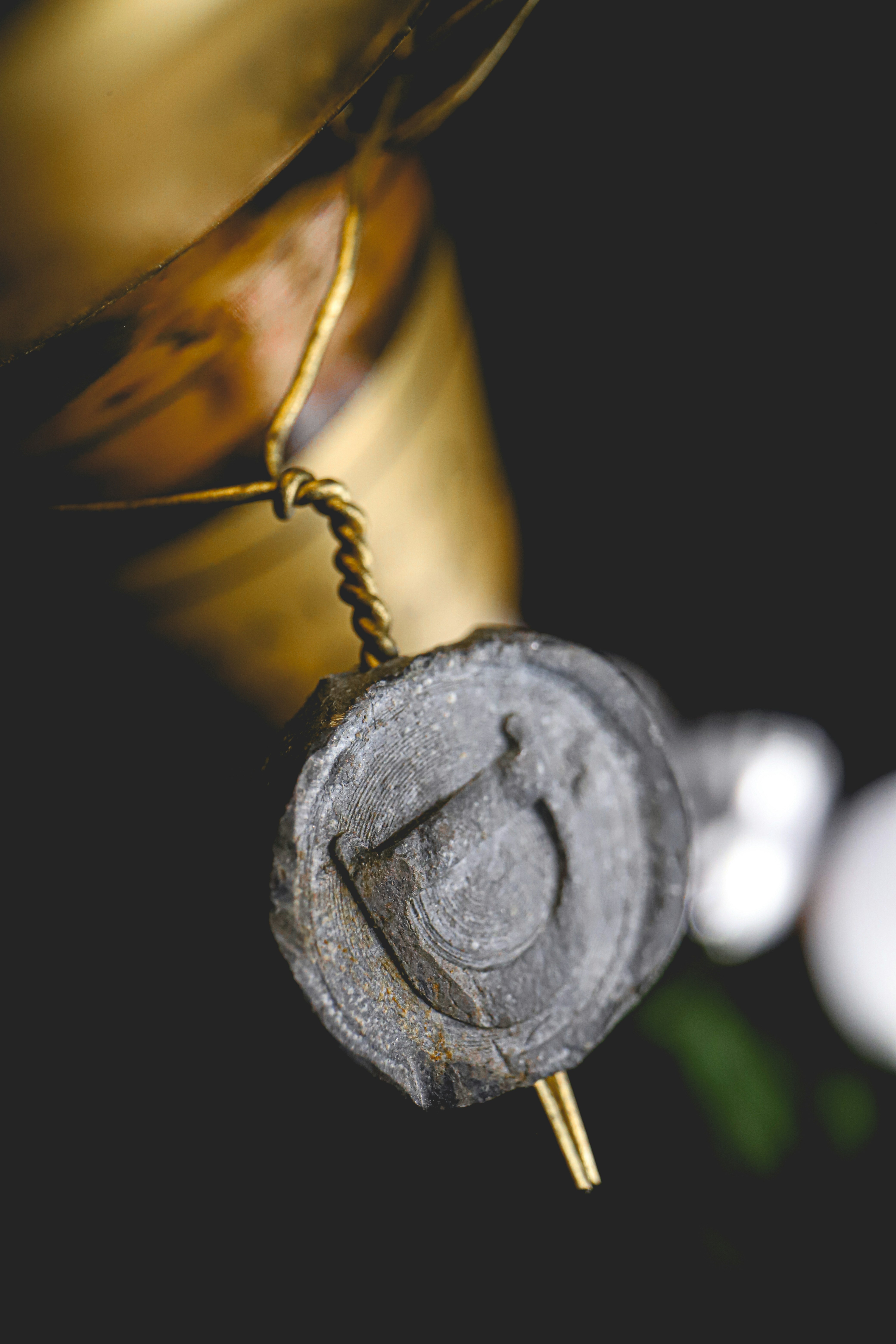 silver round coin on brown wooden surface