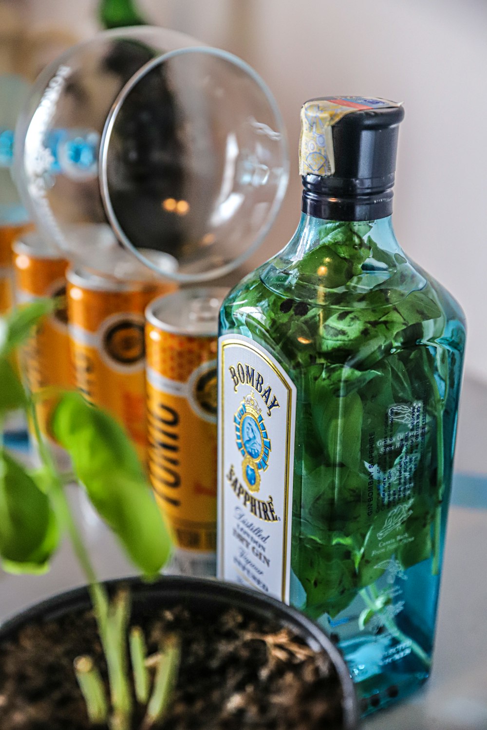 green glass bottle beside clear glass bottle