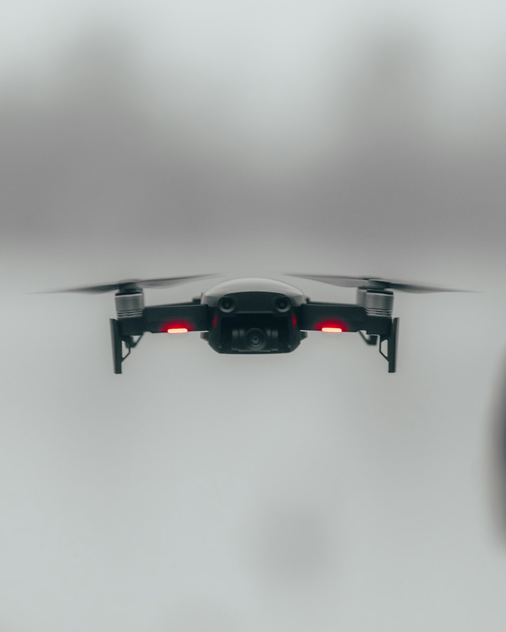 black and red drone in mid air