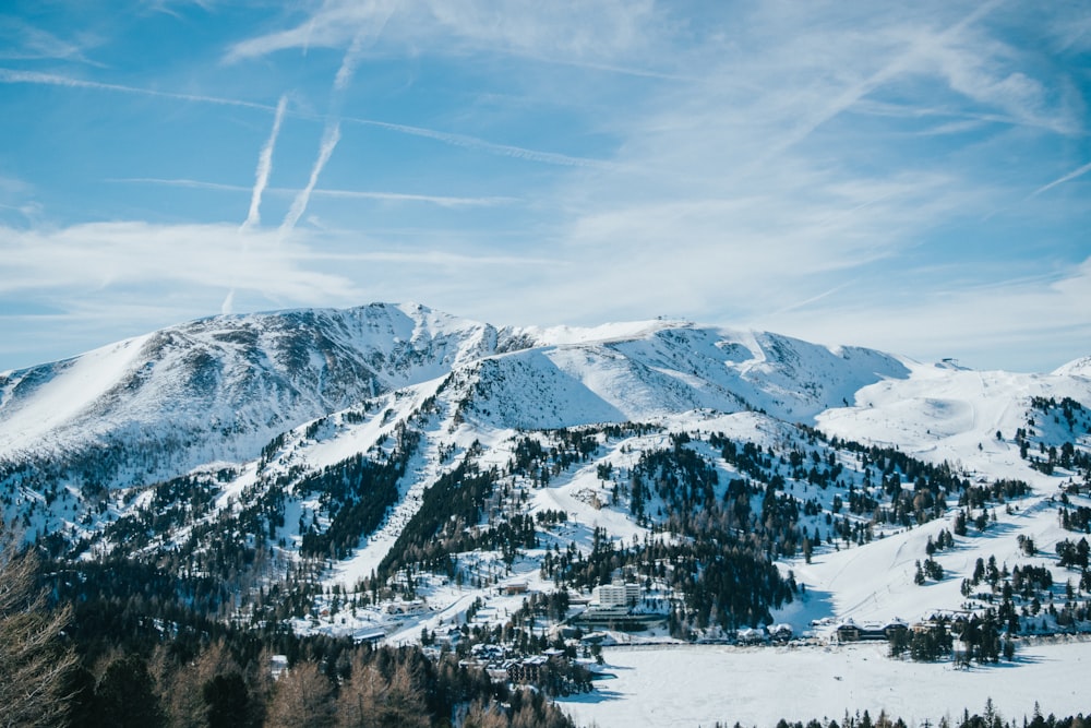 a view of a snowy mountain range from a distance