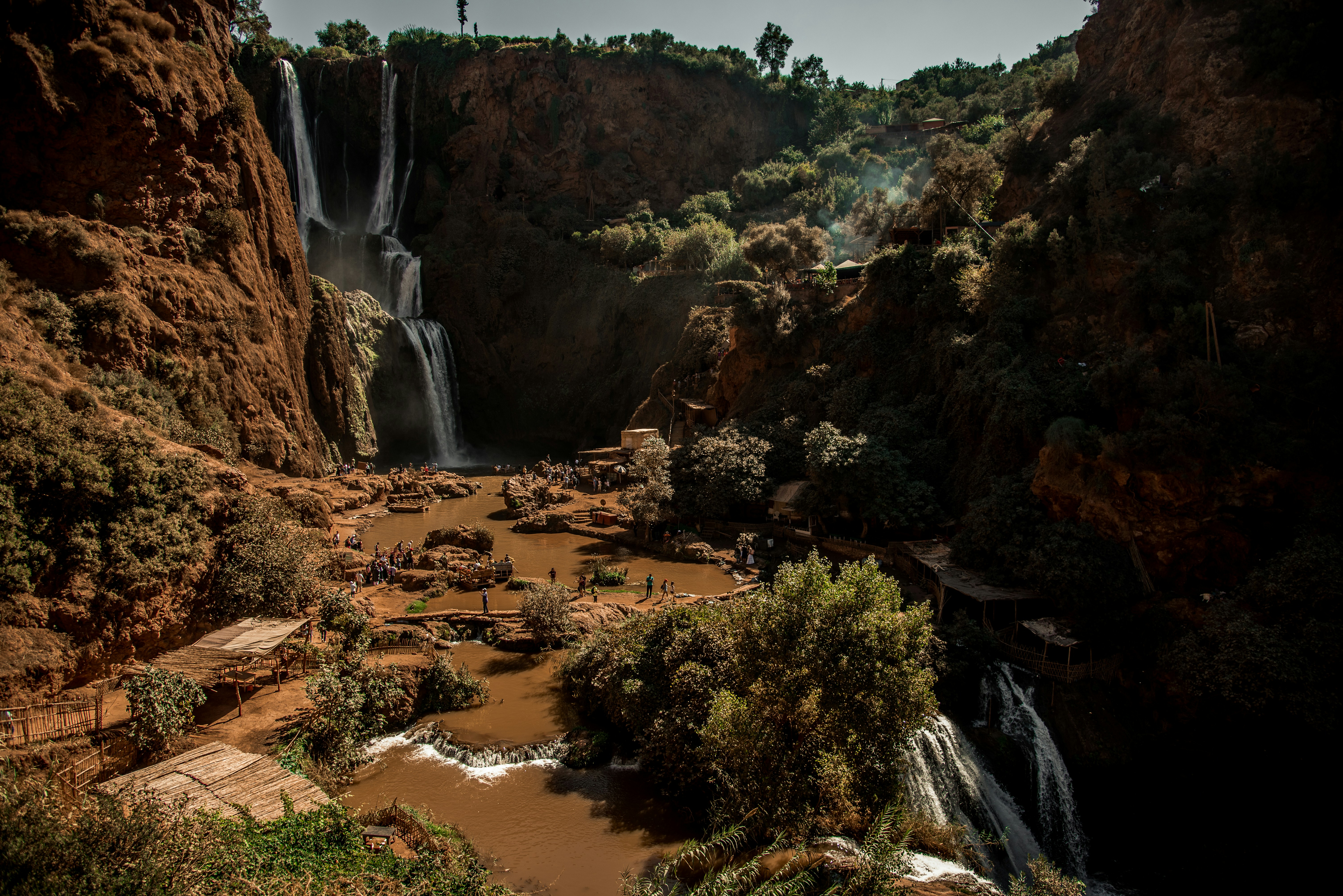 waterfalls in the middle of the forest during daytime