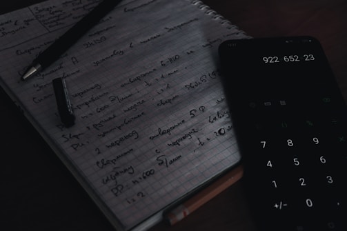 white graphing paper on brown wooden table