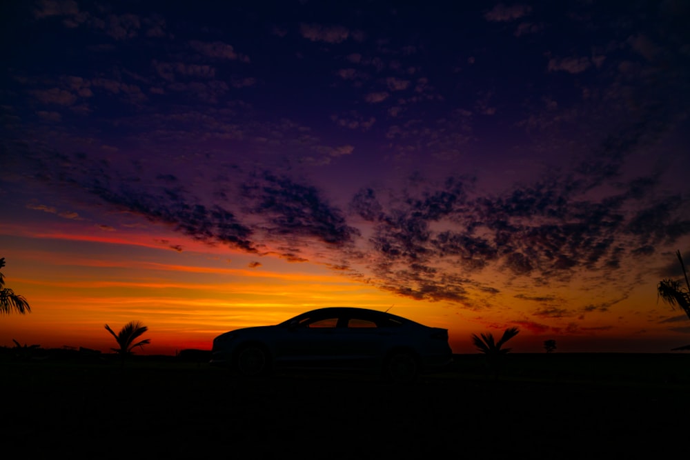 silhouette of car during sunset