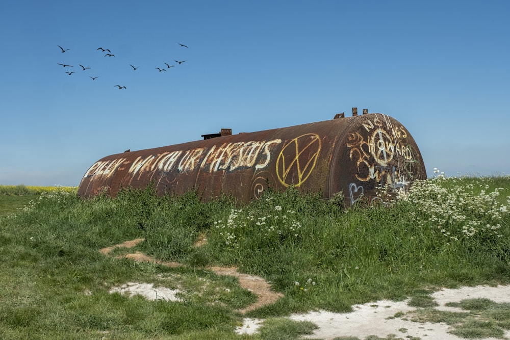 brown wooden wall with graffiti