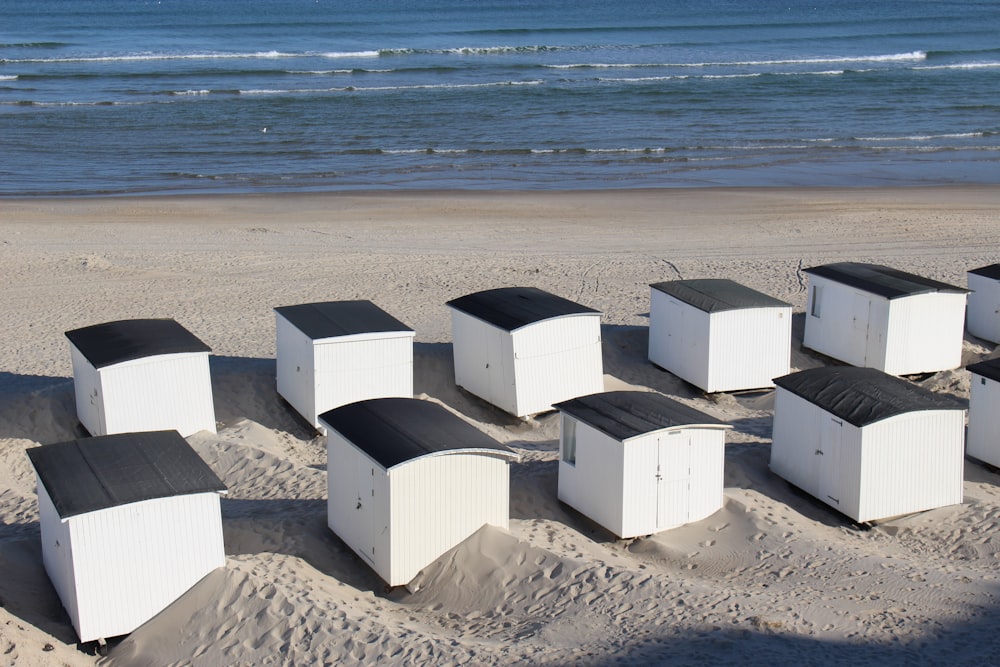 white concrete building on beach shore during daytime