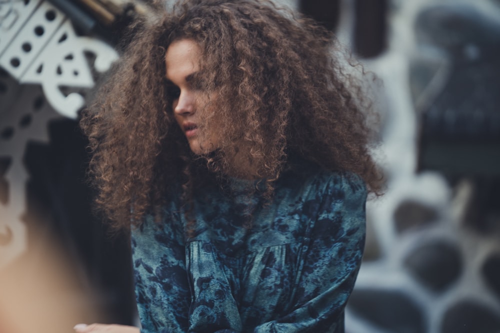 man in blue and black tie dye shirt