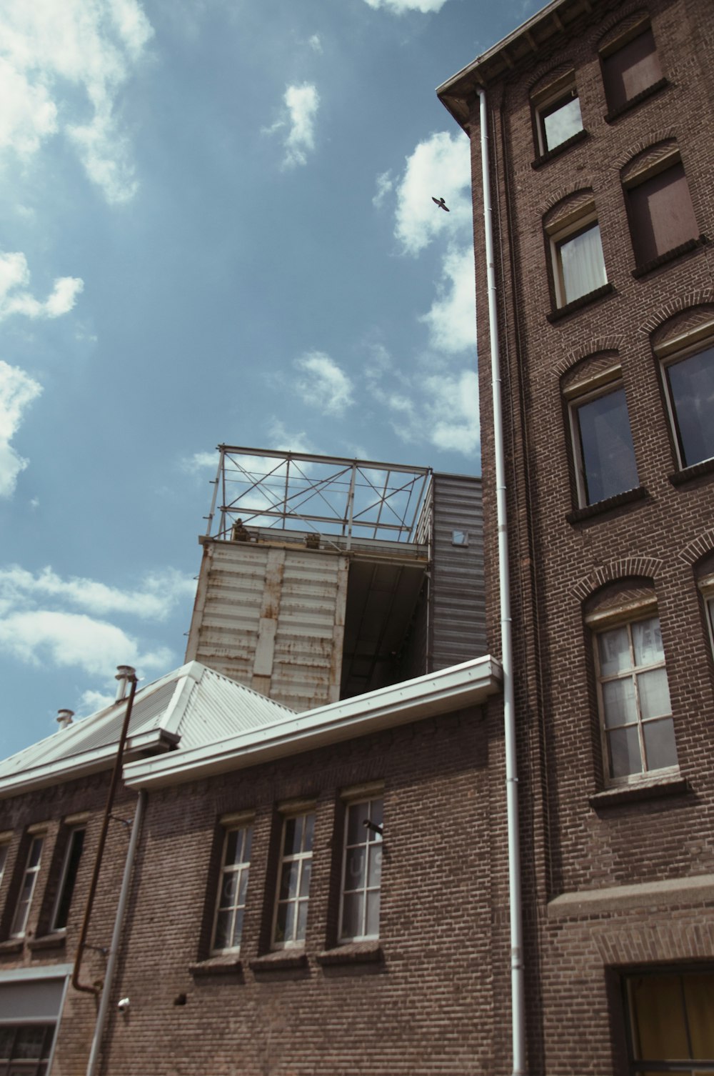 brown concrete building under blue sky during daytime