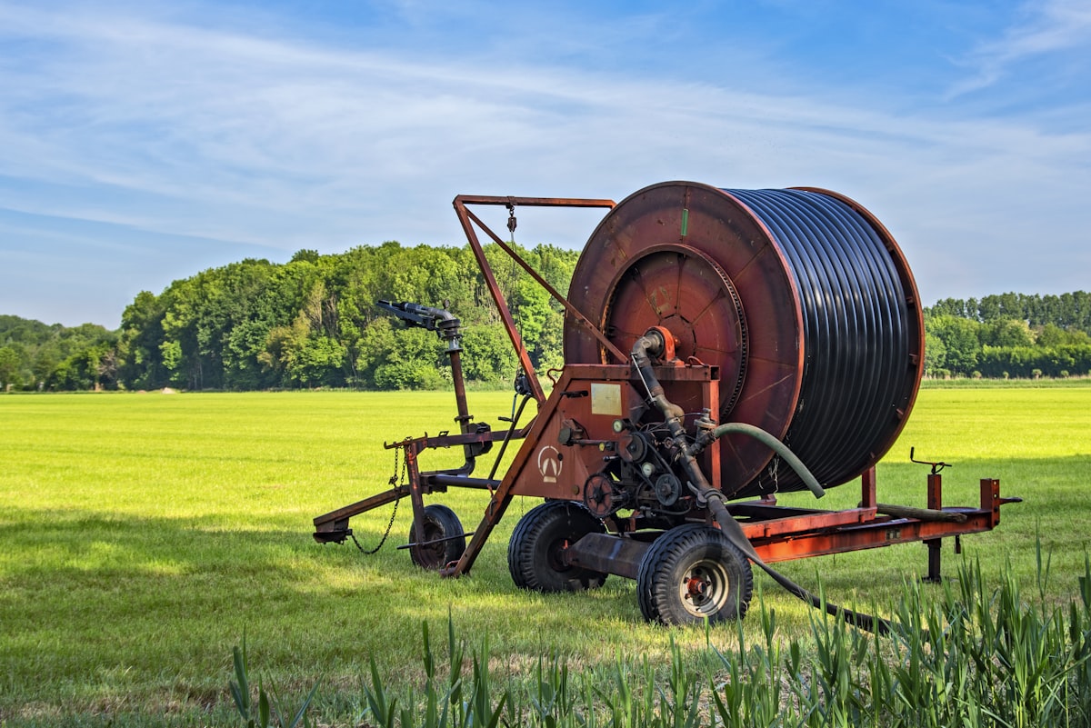 Irrigation sprinkler system watering a green lawn
