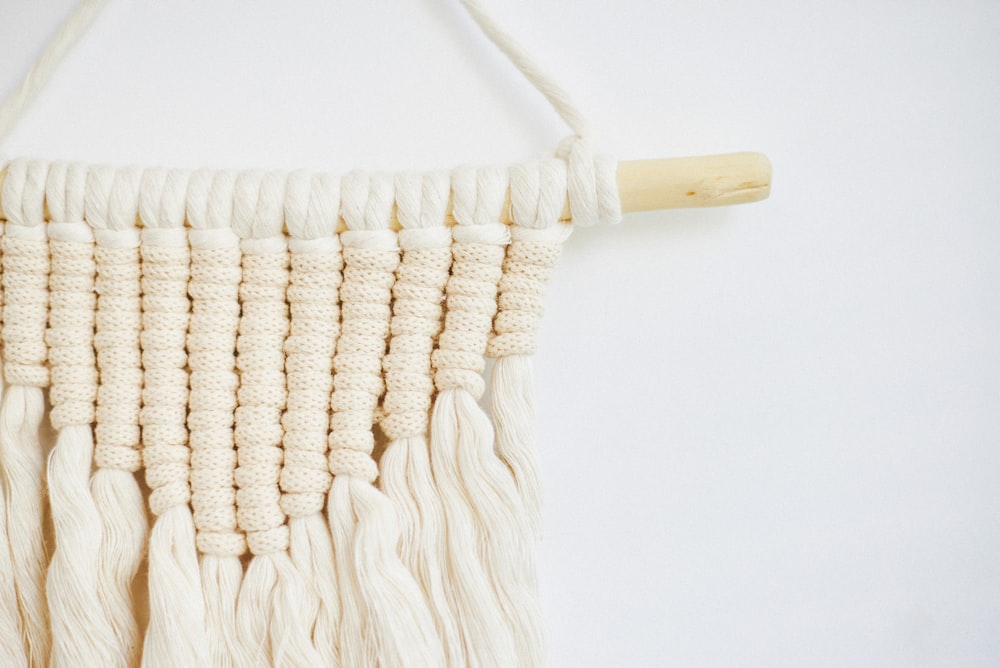 white and brown knit textile