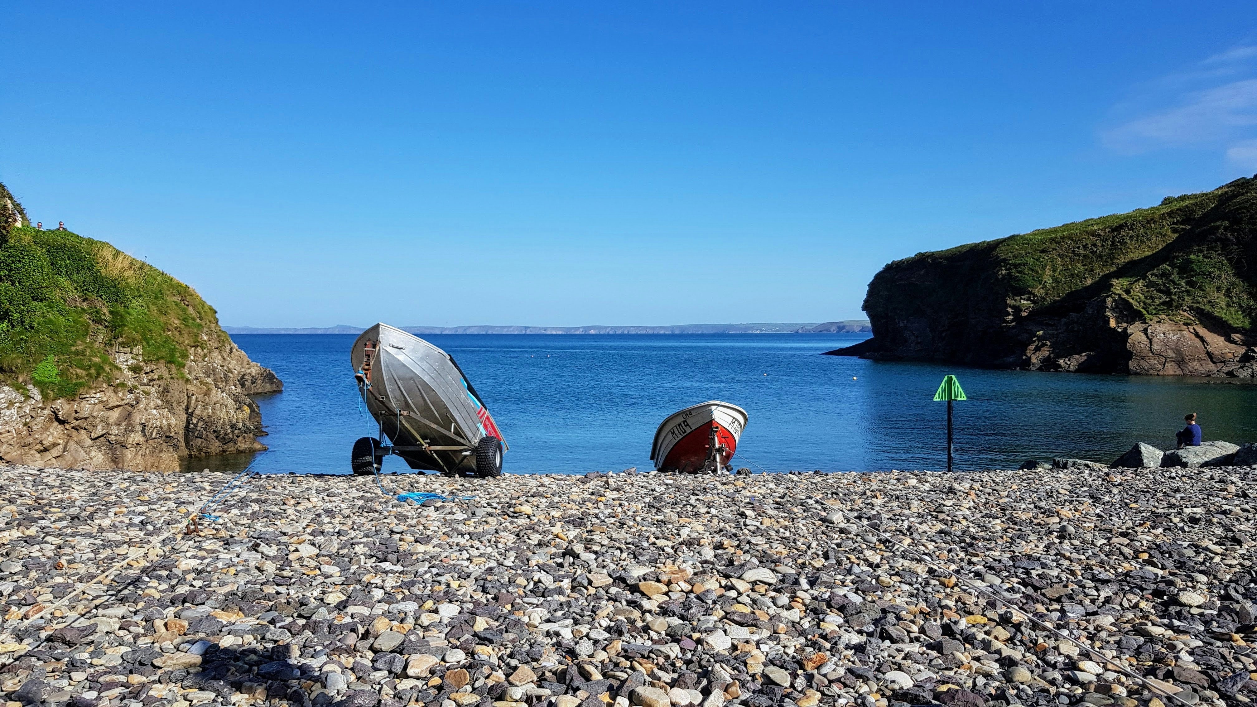 Boats Aligned Next to the Sea