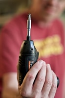 Electric drill with a sleek design placed on a clean white background