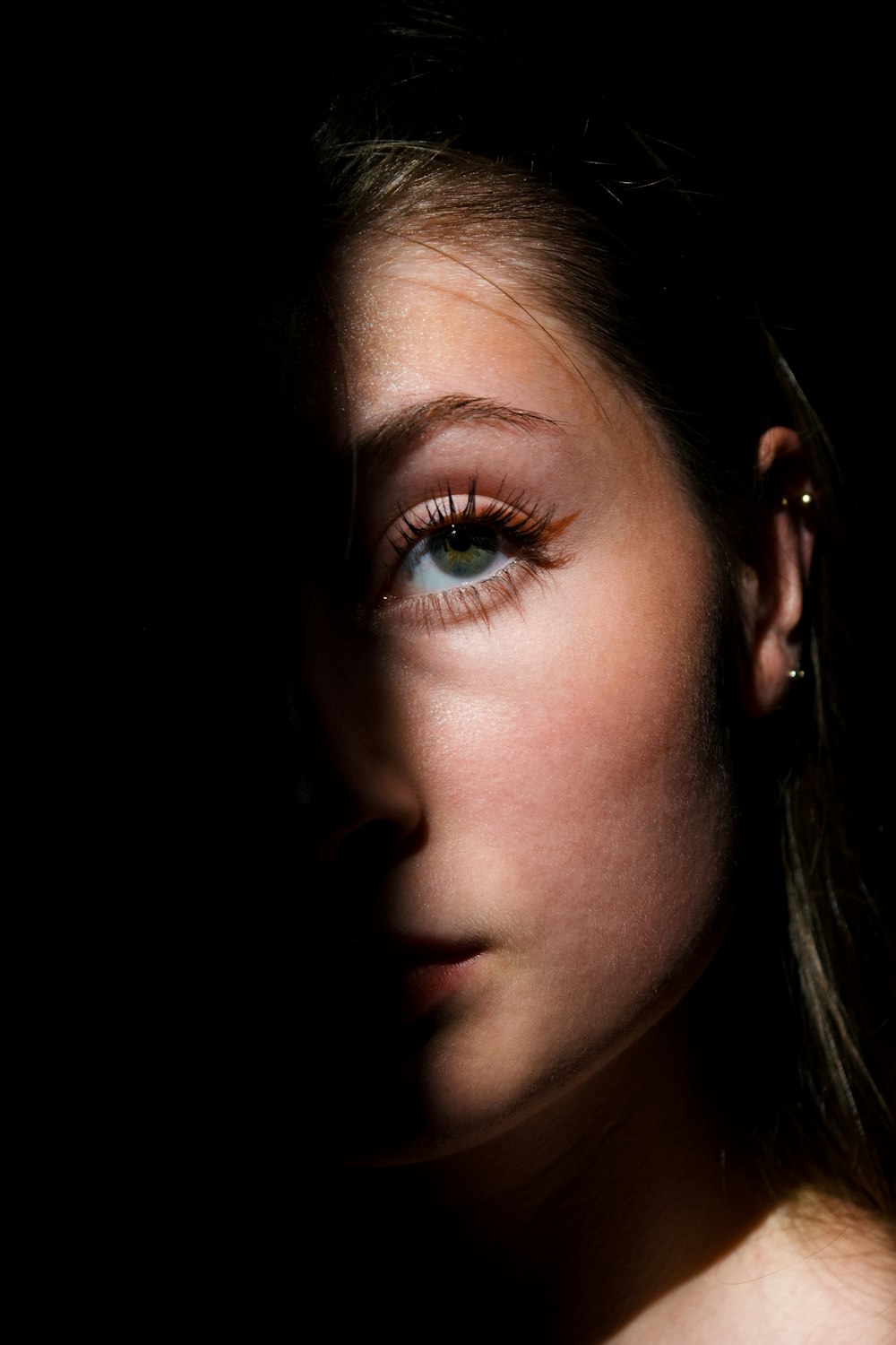 woman with green eyes and brown eyes