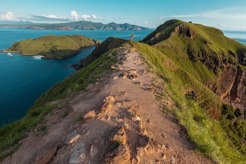 a dirt path leading to the top of a mountain