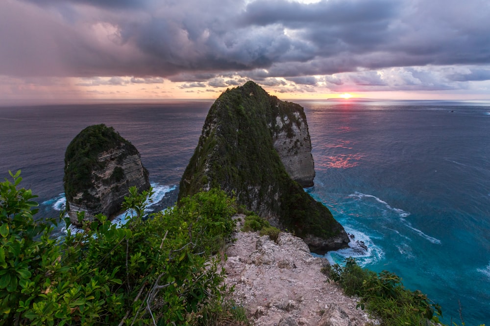 a view of the ocean from the top of a hill