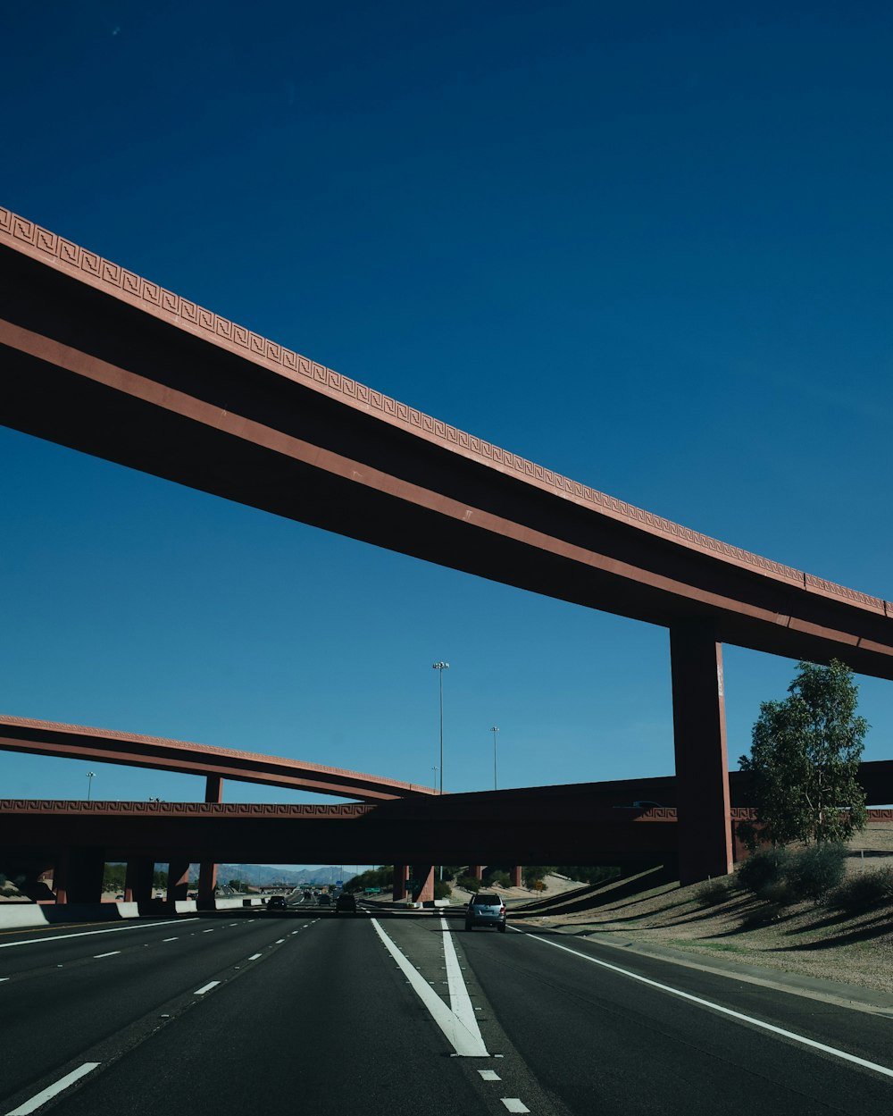 brown bridge under blue sky during daytime