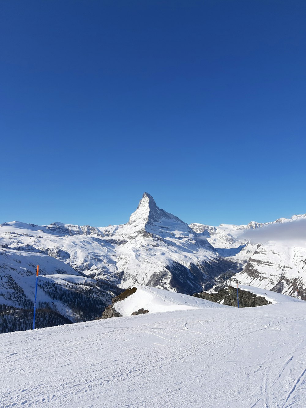 snow covered mountain under blue sky during daytime