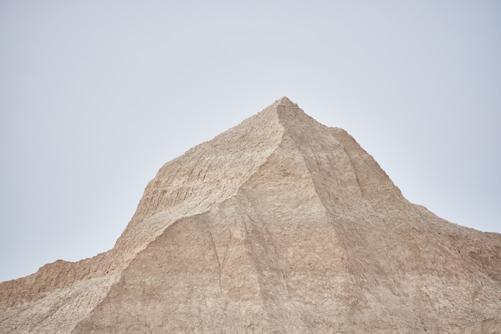 brown rock formation under blue sky during daytime