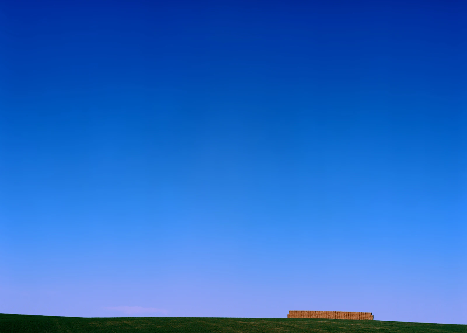 Forestry mulcher grinding cedar and brush on a North Texas clearing