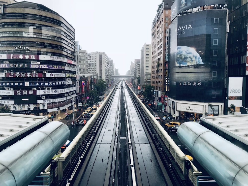 gray train on rail road during daytime