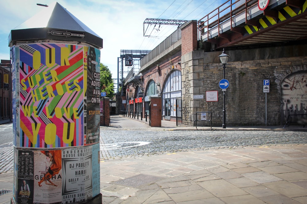 graffiti on wall near road during daytime