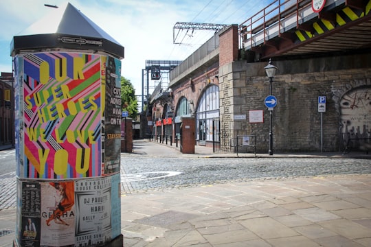 graffiti on wall near road during daytime in Leeds United Kingdom