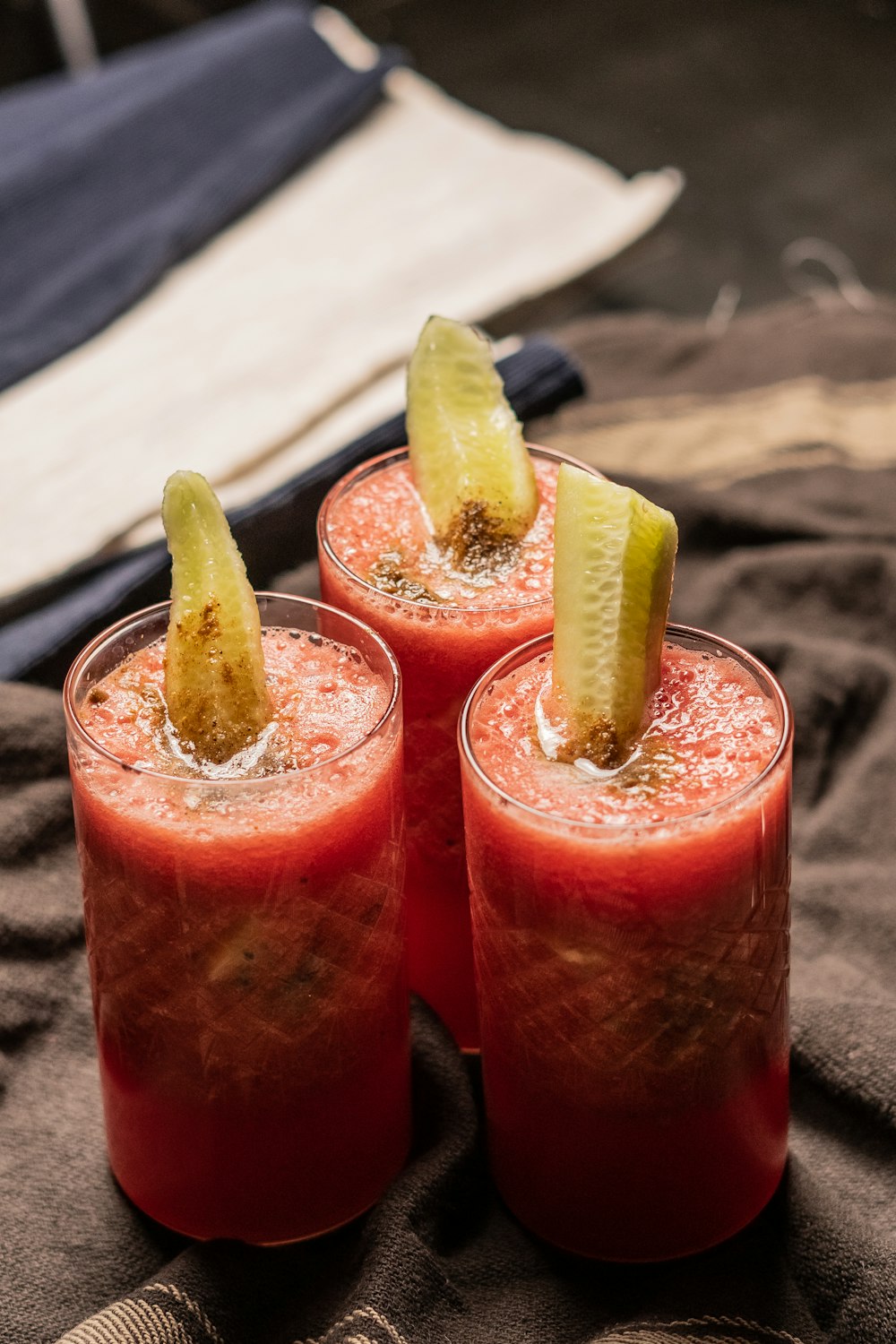 clear drinking glass with red liquid and yellow banana fruit