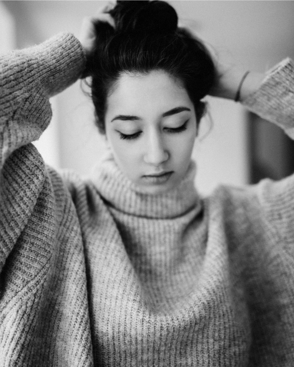 woman in gray knit sweater