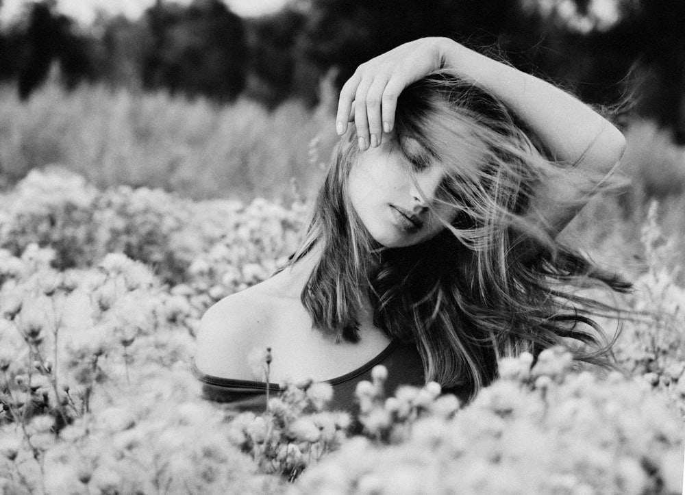 grayscale photo of woman in tank top