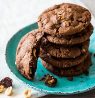 brown cookies on blue and white ceramic plate