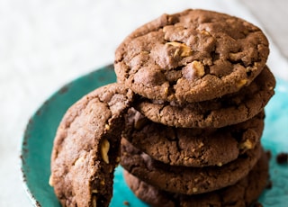 brown cookies on blue and white ceramic plate