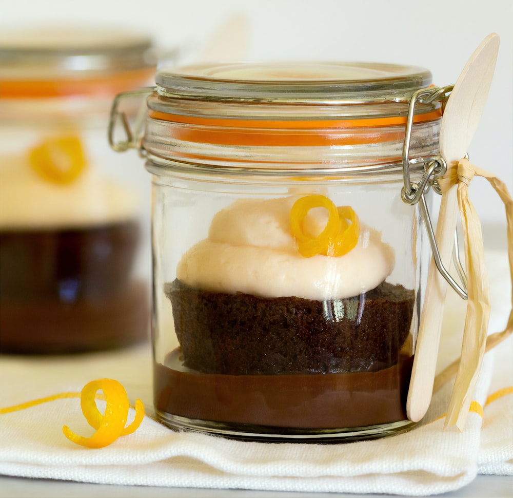 chocolate cake on clear glass jar