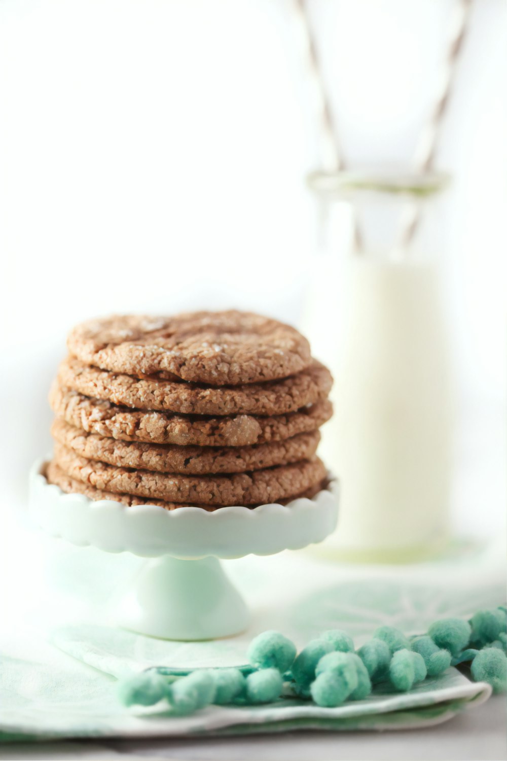 three cookies on white ceramic plate