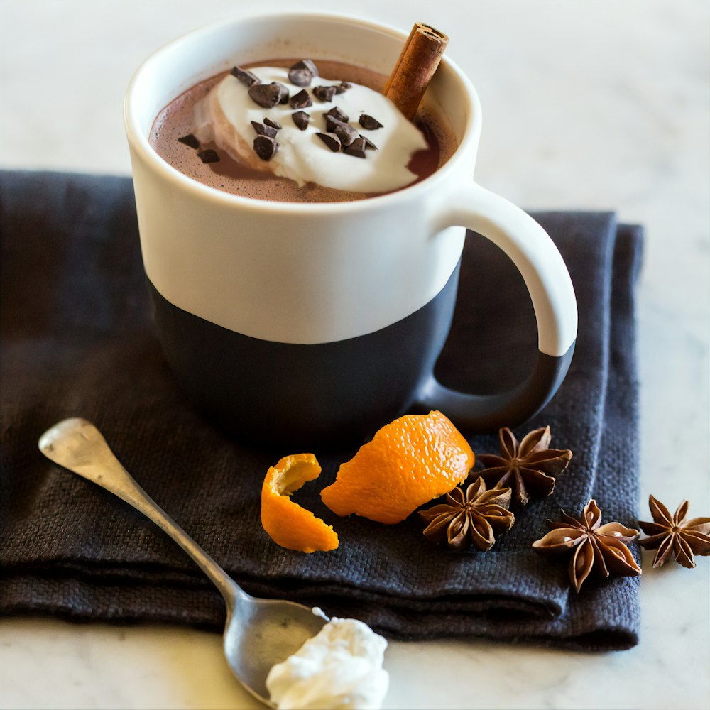 white ceramic mug with brown and black liquid