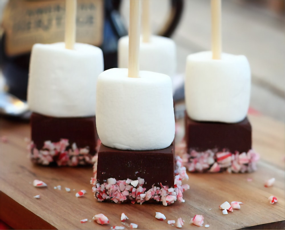 white and brown ice cream on brown wooden stick