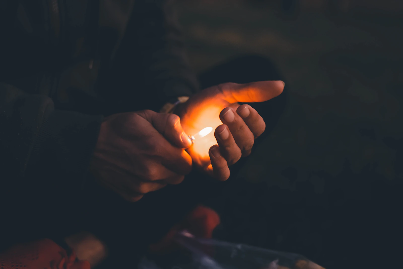 Warm silhouettes of people joining hands in golden sunlight, interconnected
