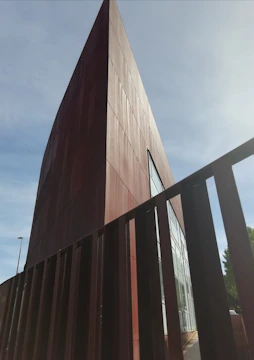 A sturdy metal building framed against a bright Texas afternoon.