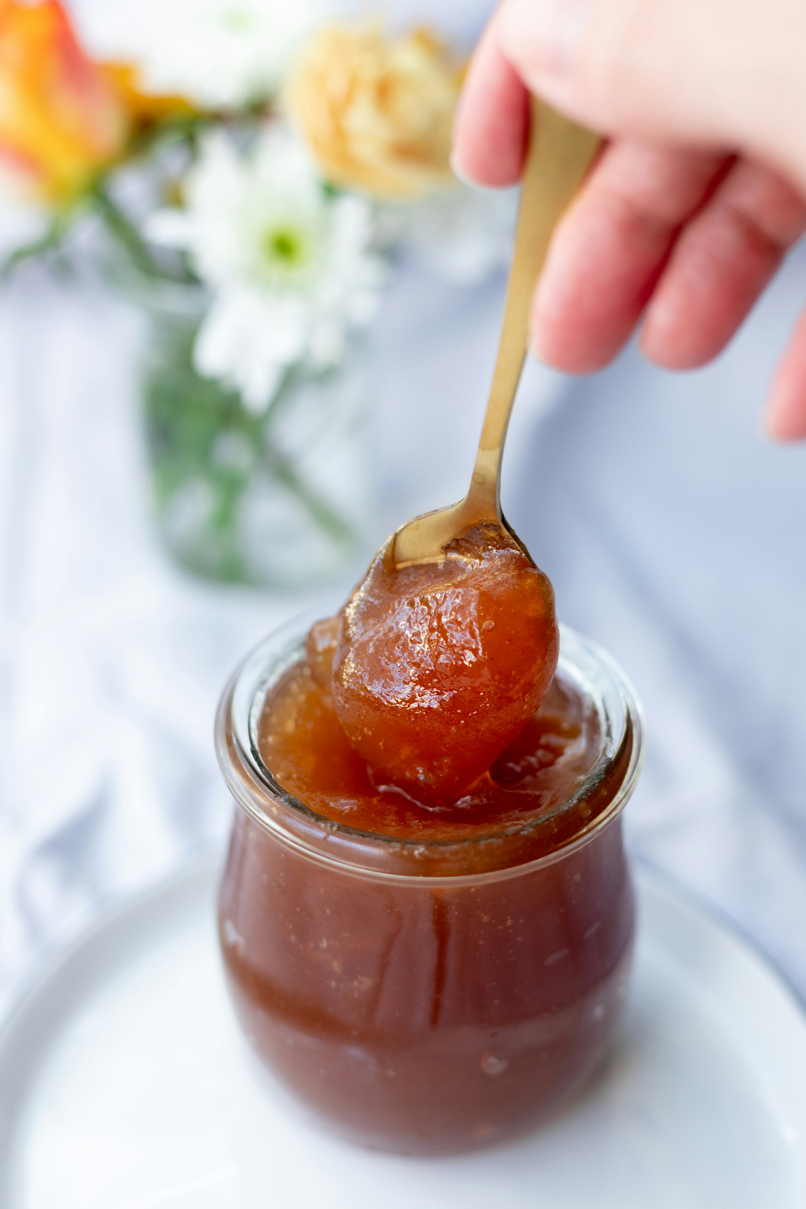 clear glass jar with brown liquid