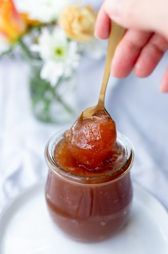 clear glass jar with brown liquid