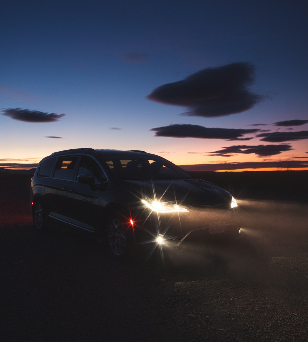 black suv on road during night time