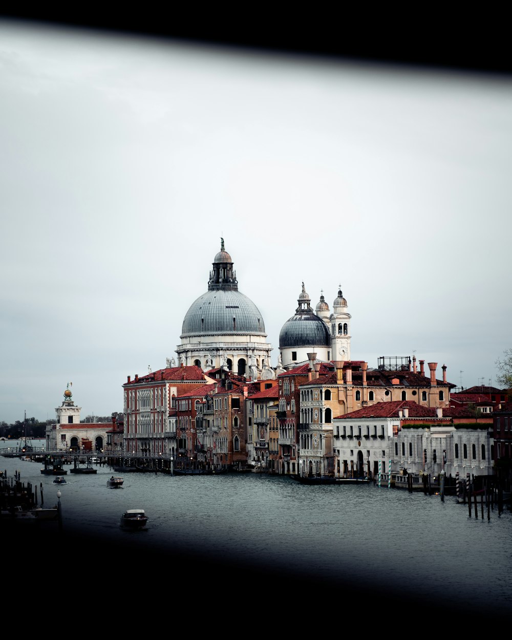 white and brown dome building near body of water during daytime