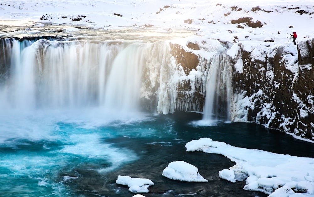 white ice on water falls