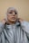 woman in gray zip up jacket wearing silver framed eyeglasses