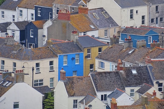A collection of different roof styles on various houses.