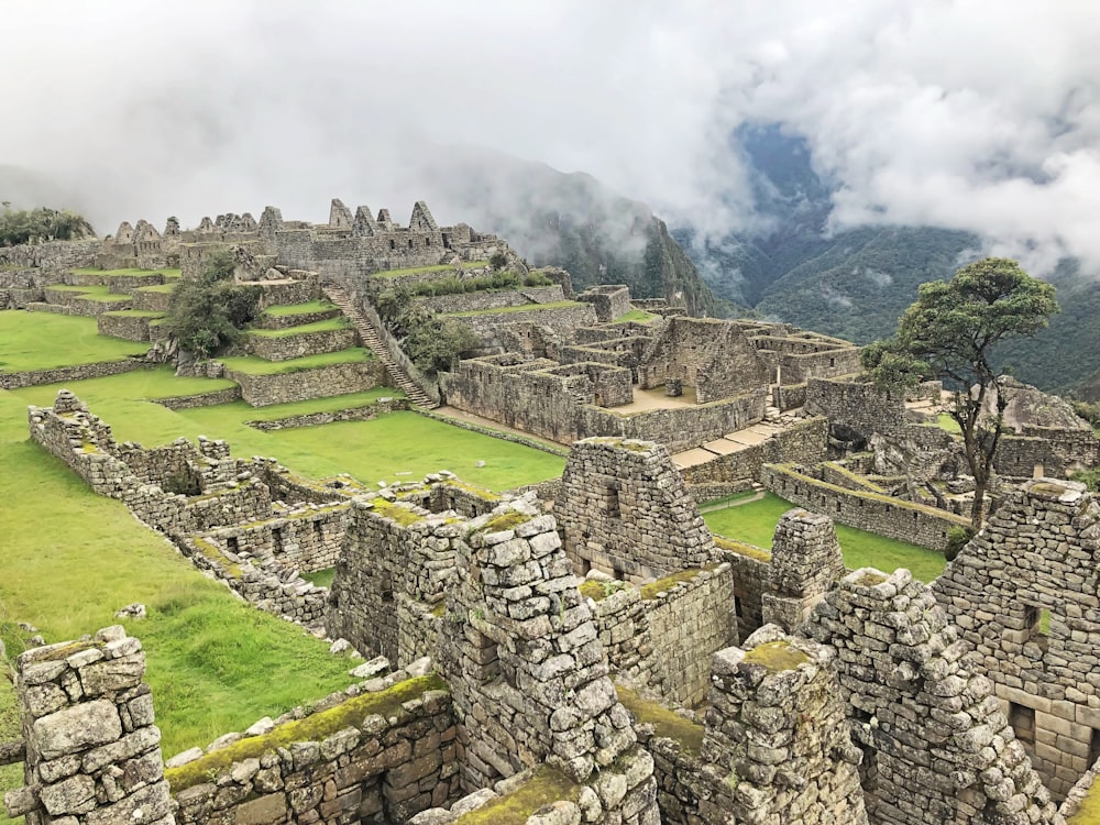 the ruins of machaca picchuta are surrounded by clouds