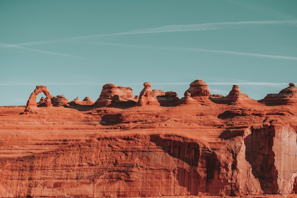 brown rock formation under blue sky during daytime