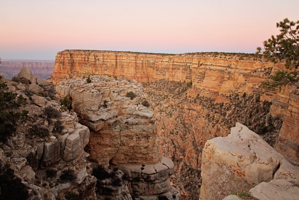 brown rock formation under white sky during daytime