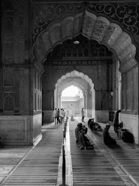 people sitting on bench inside building