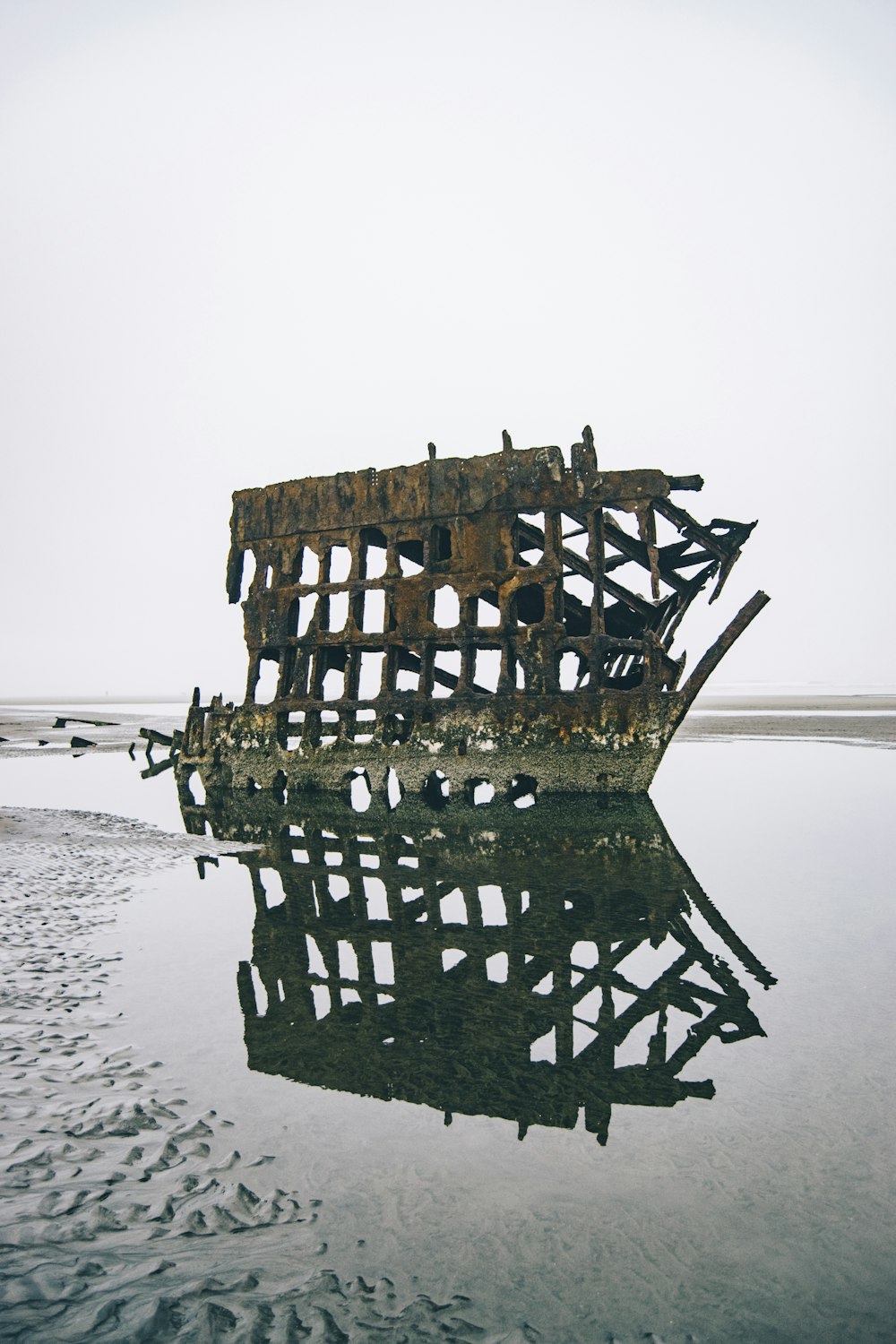 brown wooden frame on body of water